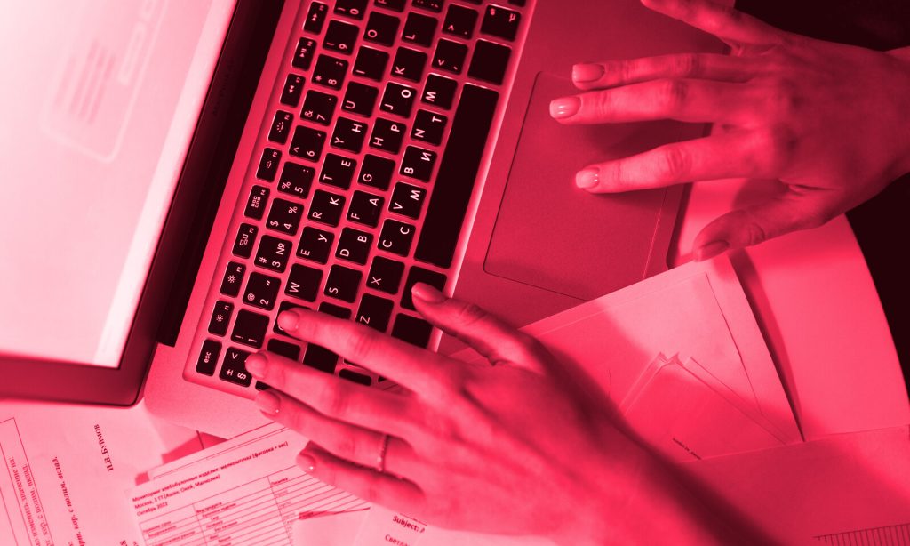 Form abandonment analysis — hands typing on a laptop